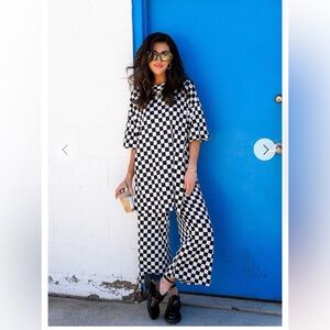 Dressed in LALA playsuit in Black and White Checkerboard.